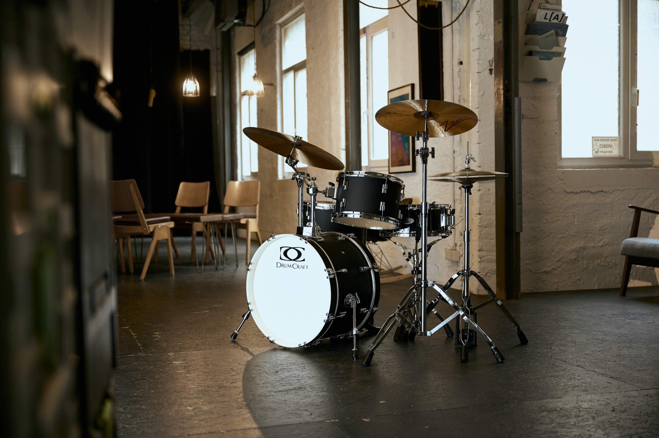 Urban Beats drum kit set up in a stylish studio with warm lighting and modern decor.